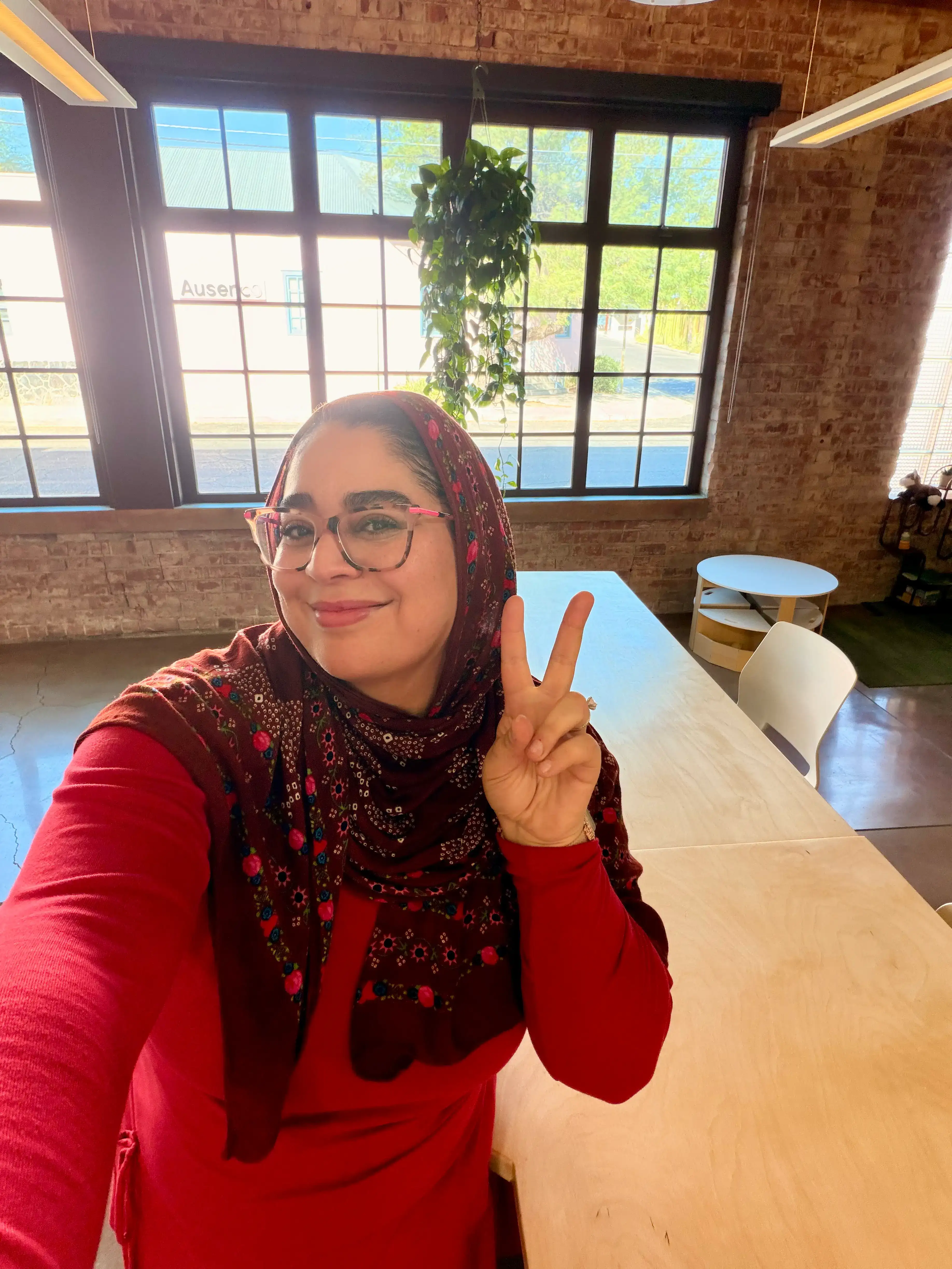Noor smiling indoors